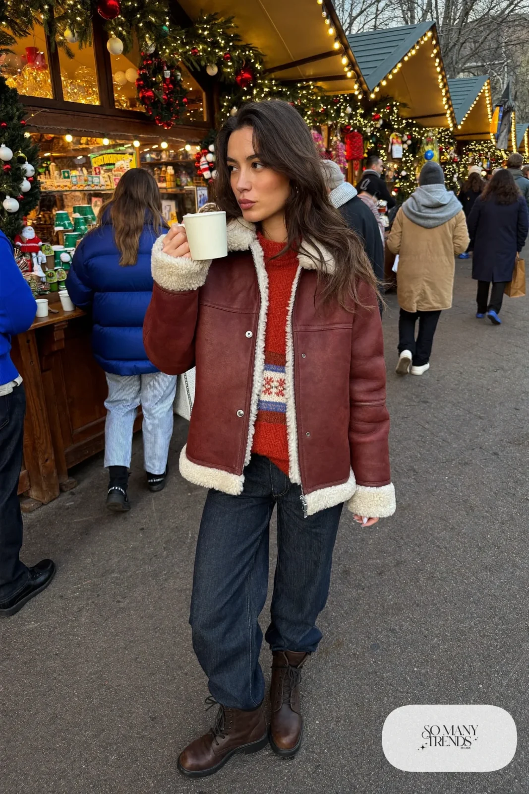 shearling jacket rust chunky sweater dark straight jeans insulated waterproof brown boots outfit 14