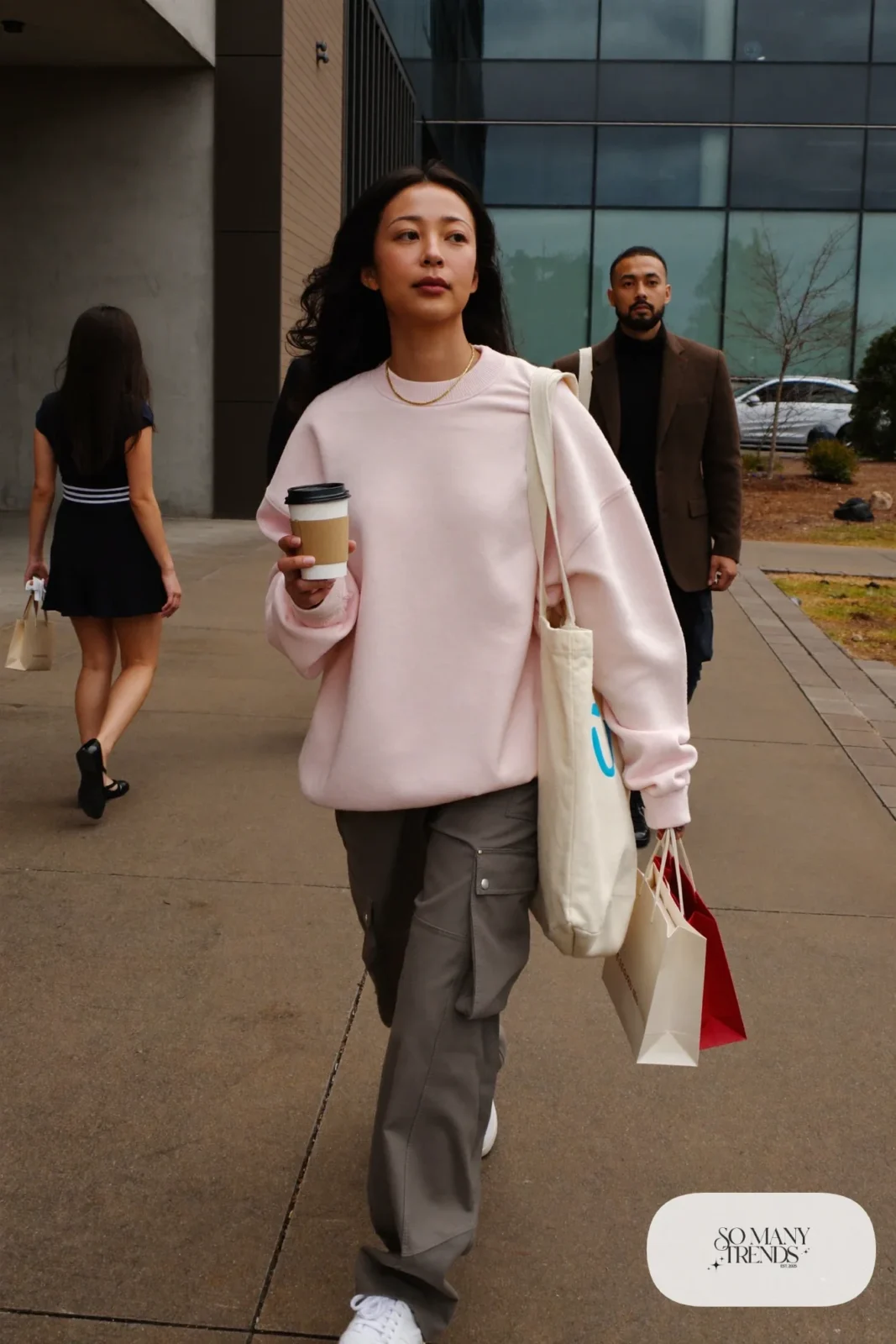 pale pink crewneck sweatshirt charcoal cargo pants leather sneakers canvas bag gold chain valentines casual work outfit 7