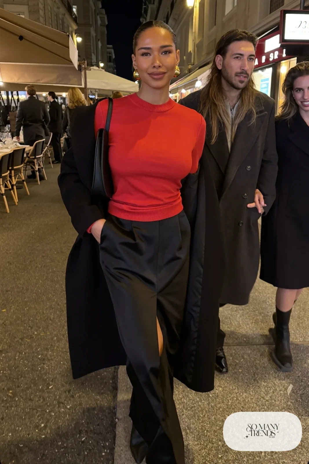 black satin maxi skirt fitted red knit top long black leather coat pointed boots small bag gold earrings valentines dinner outfit 31