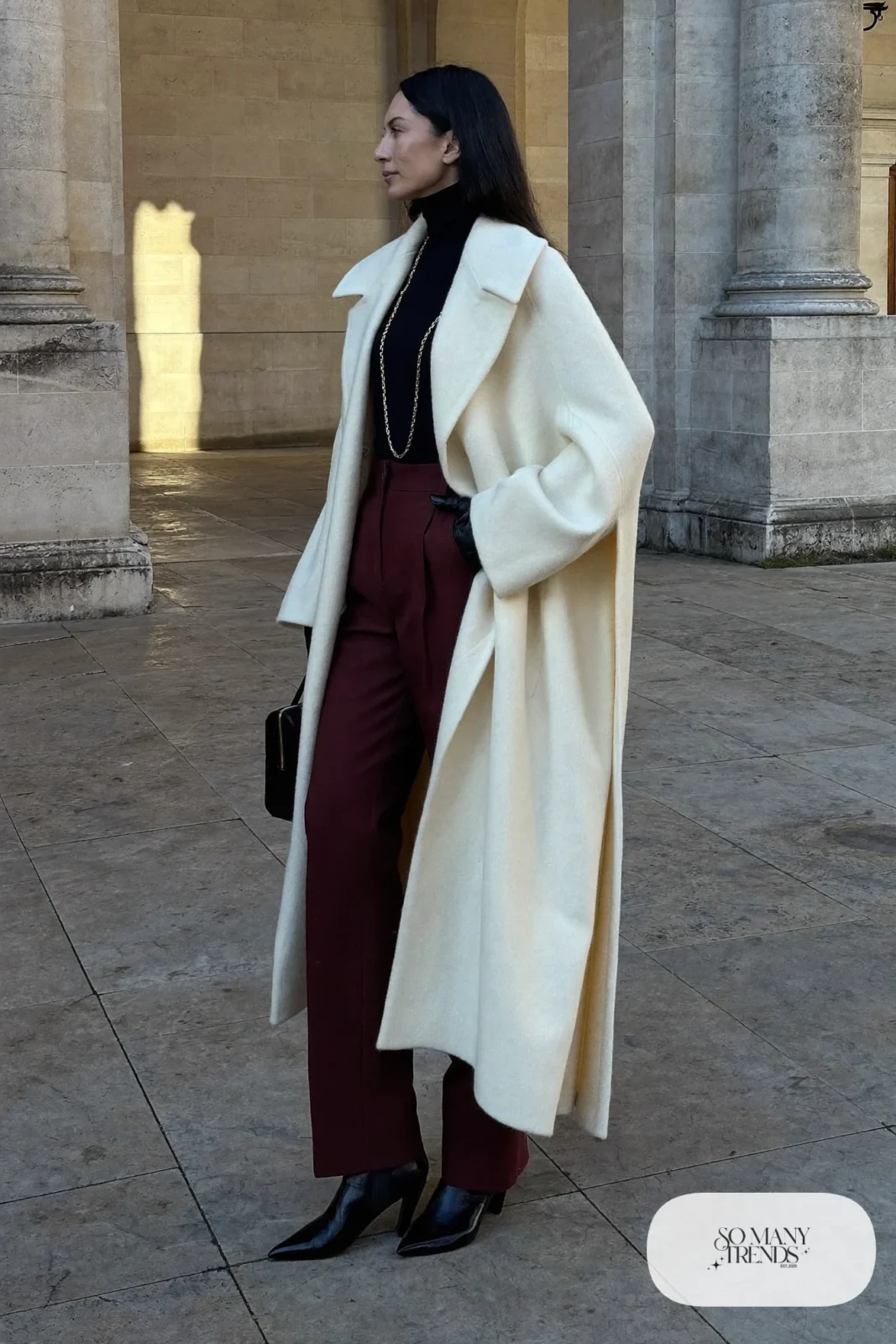ivory cape coat burgundy straight pants black turtleneck black boots outfit 11