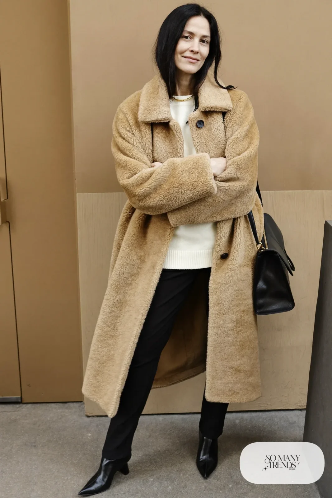 camel teddy coat black slim pants pointed black boots cream sweater outfit 13