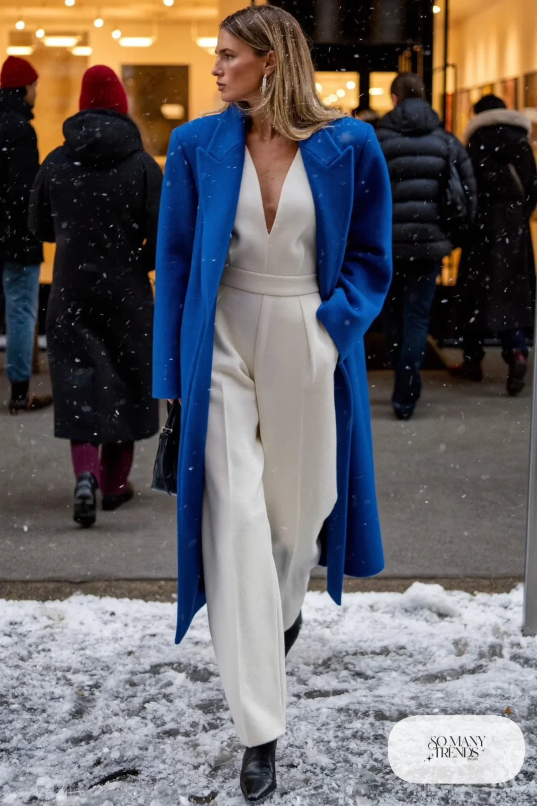 white wool blend jumpsuit cobalt blue long coat black ankle boots silver earrings outfit 10
