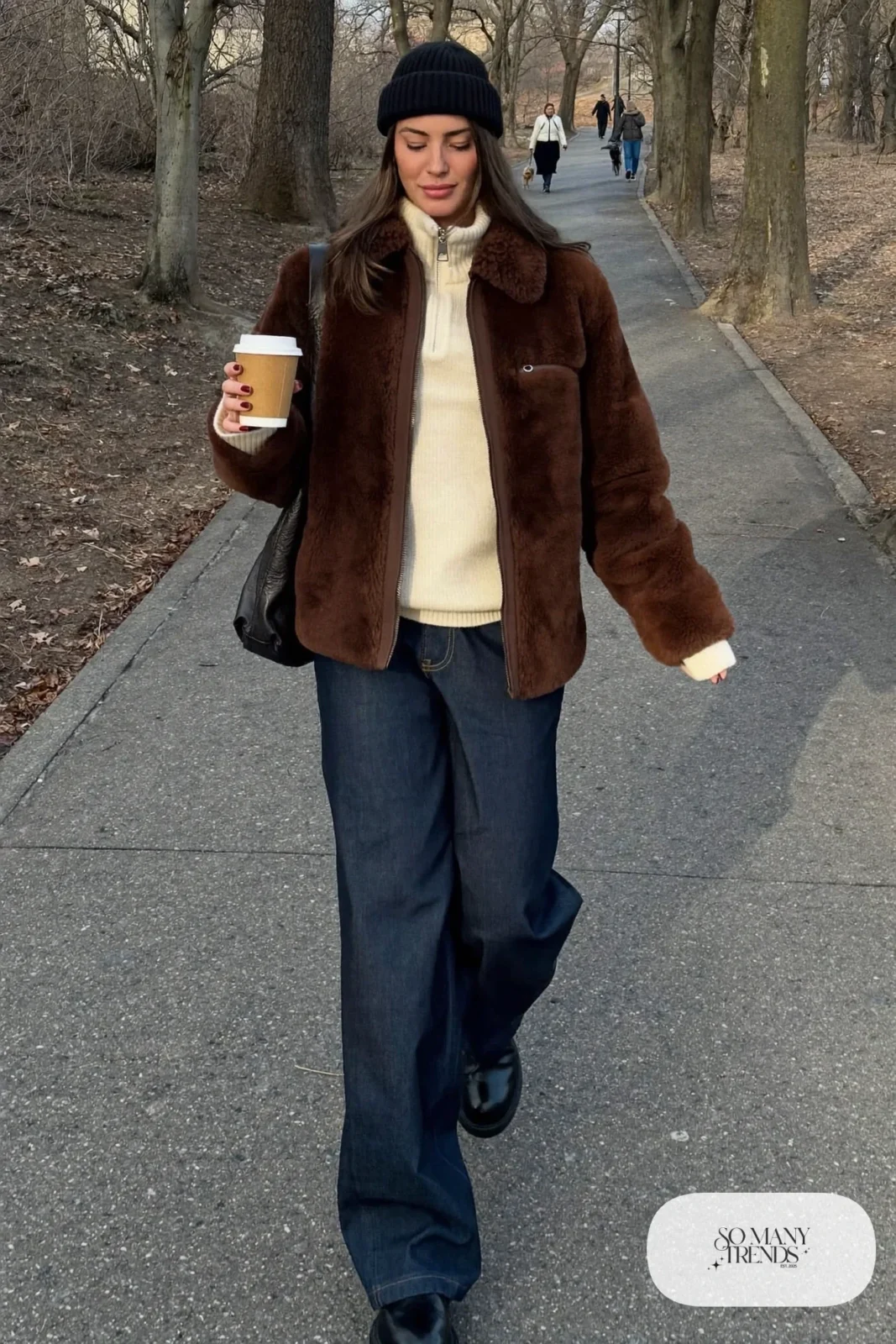 cream half-zip sweater chocolate faux shearling jacket dark wide-leg jeans chunky black boots shoulder bag outfit 22