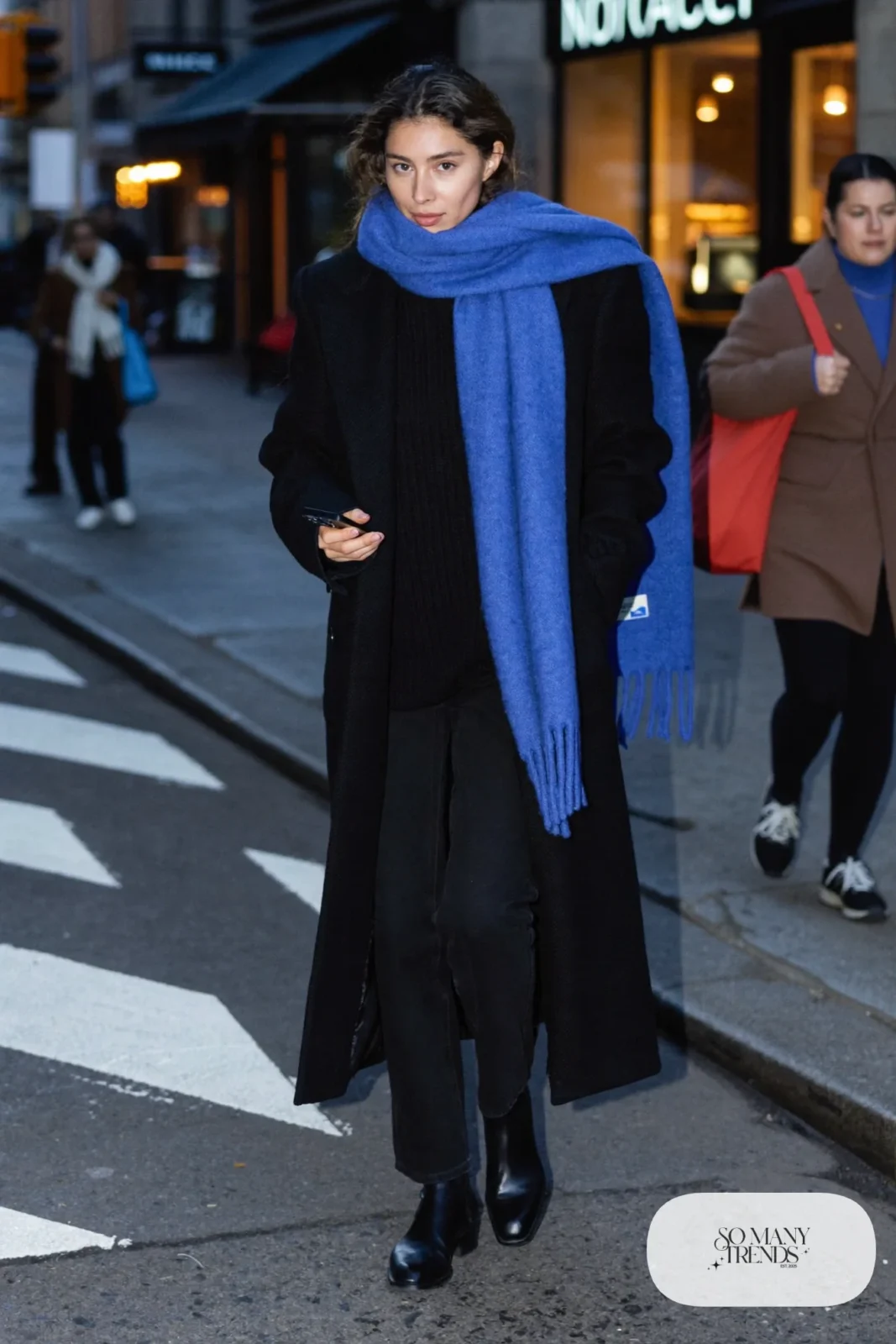 black oversized wool coat cobalt blue scarf black straight pants black boots outfit 5