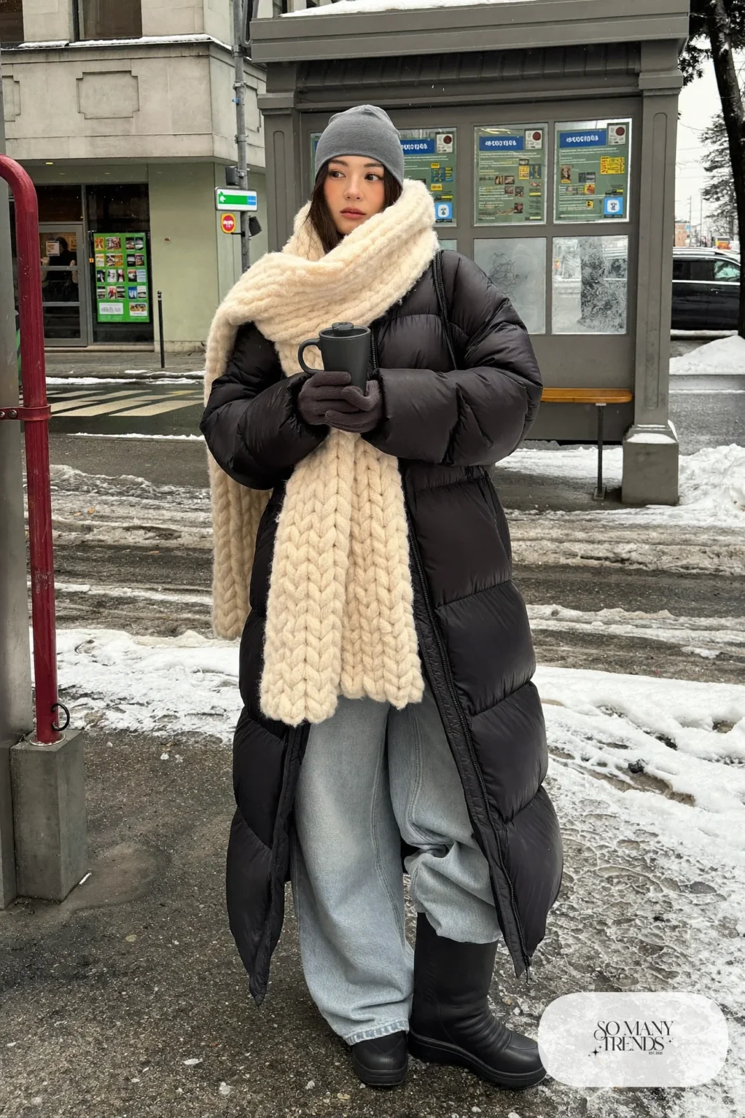 chunky cream knit scarf black long puffer coat wide-leg jeans black boots beanie outfit 7
