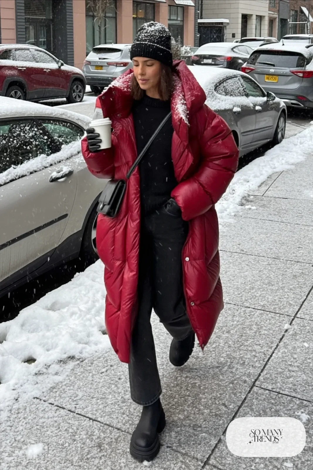 cherry red long puffer coat black sweater black jeans lug-sole ankle boots beanie outfit 6