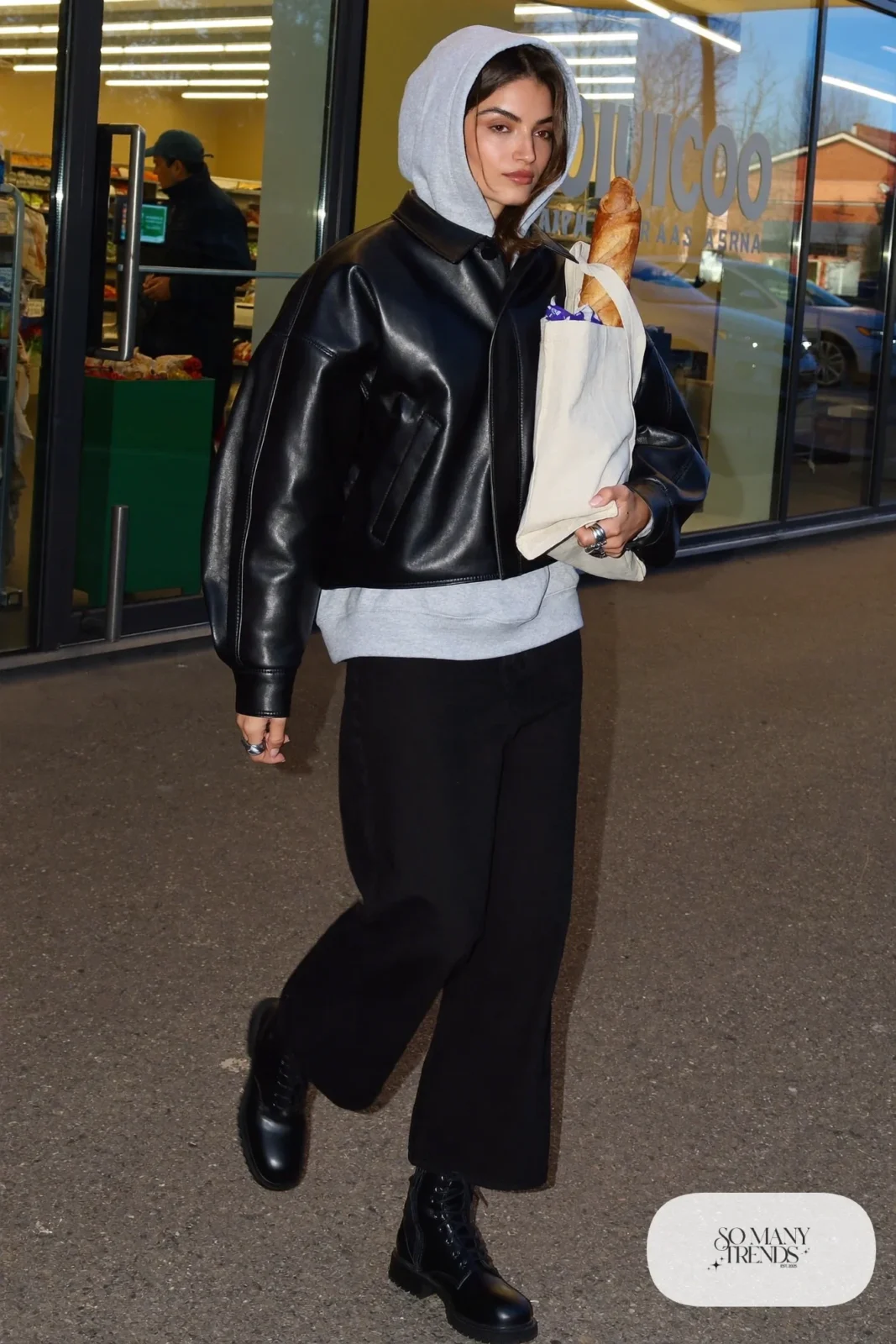 black leather jacket gray hoodie wide-leg black jeans combat ankle boots tote outfit 8