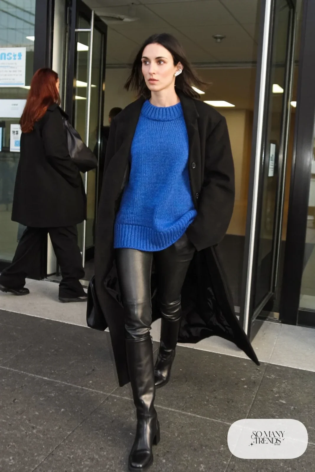 cobalt blue sweater black leather pants knee-high black boots long black coat outfit 15