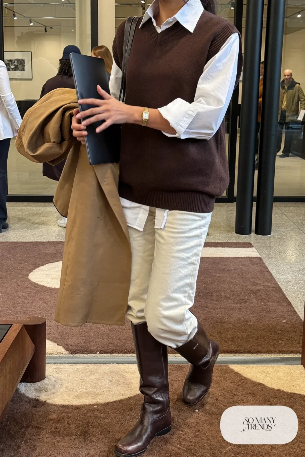 chocolate knit sweater vest white poplin shirt cream pants brown knee-high boots coat outfit 25