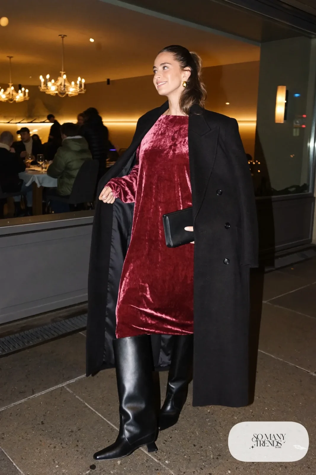 burgundy velvet midi dress tall black boots black wool coat clutch gold earrings outfit 29