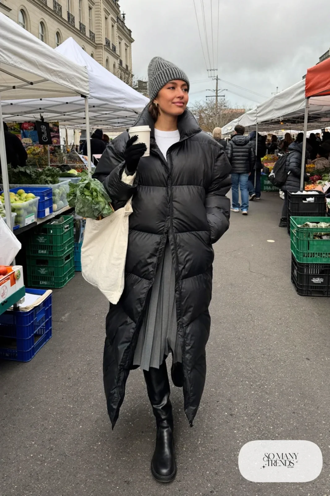 long black matte puffer coat gray pleated midi skirt white sweater tall boots outfit 19