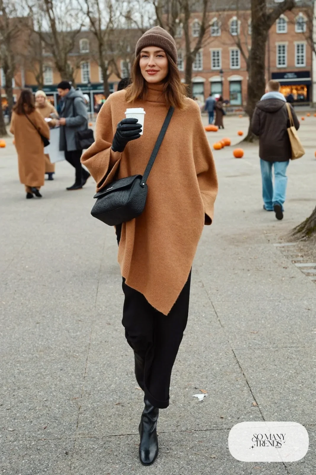 camel knit poncho black slim long skirt black knee high boots brown beanie outfit 26