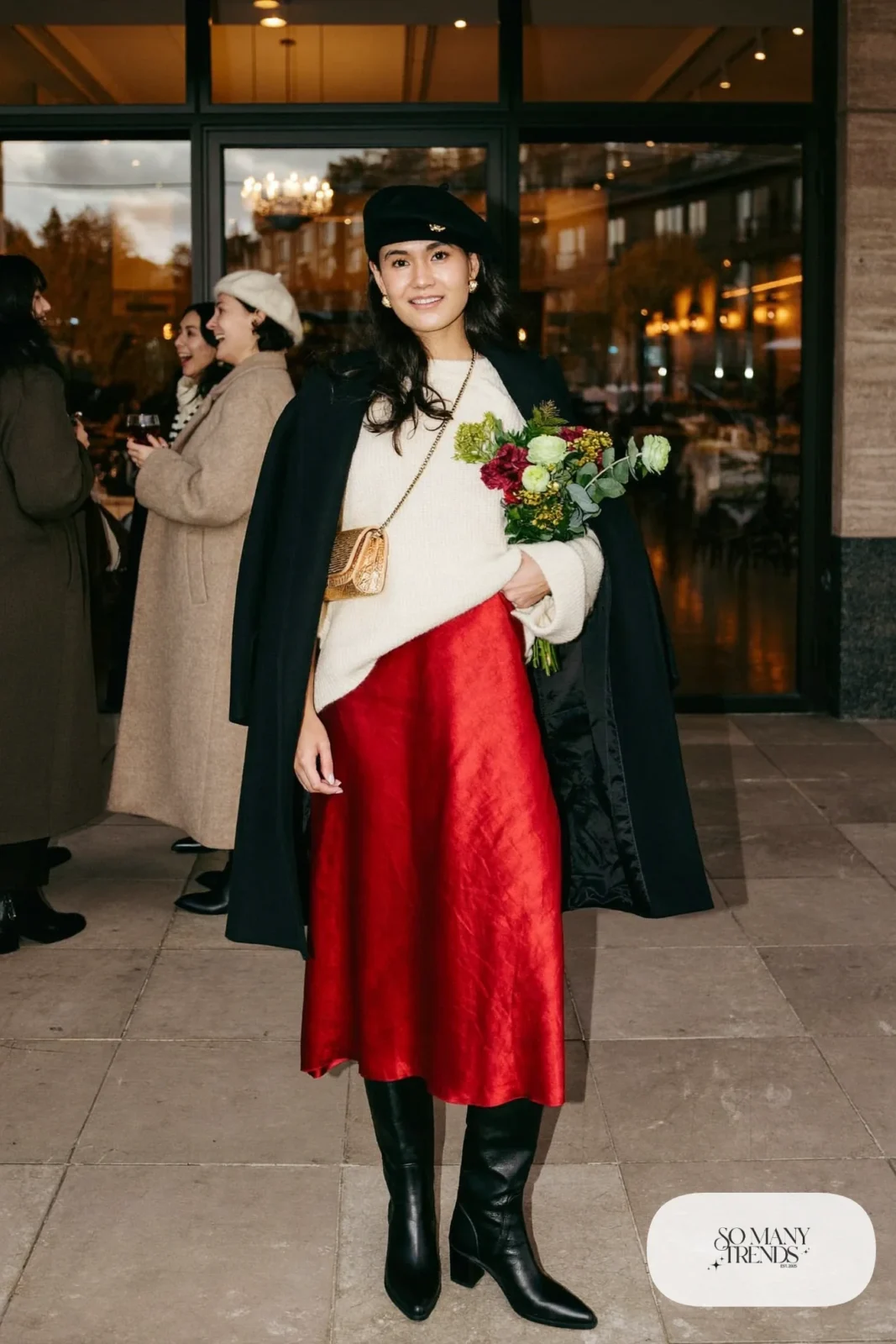 red satin midi skirt cream oversized sweater black knee-high boots black coat gold bag outfit 10
