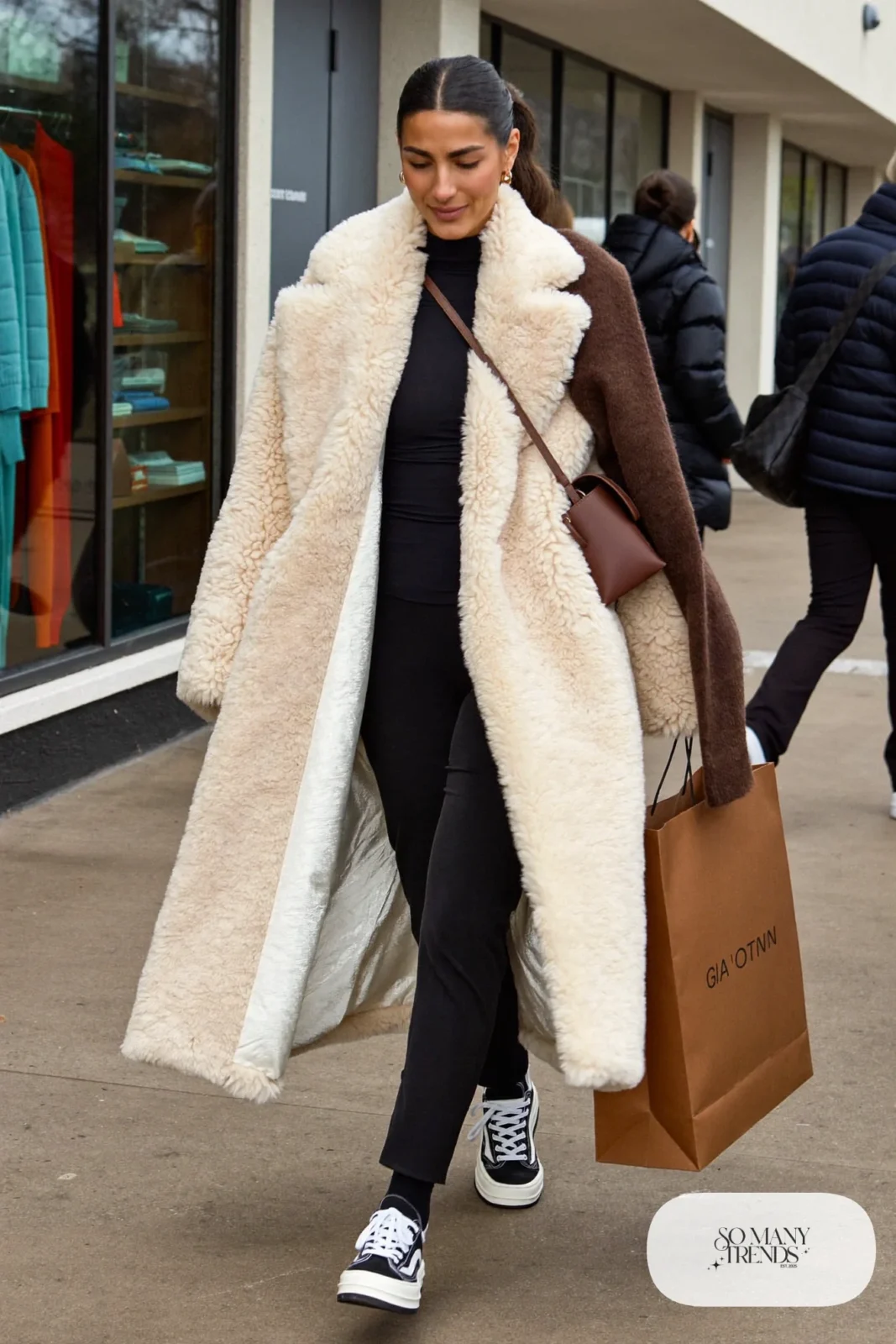 oversized cream faux shearling teddy coat black turtleneck black straight pants black white sneakers brown scarf outfit 11