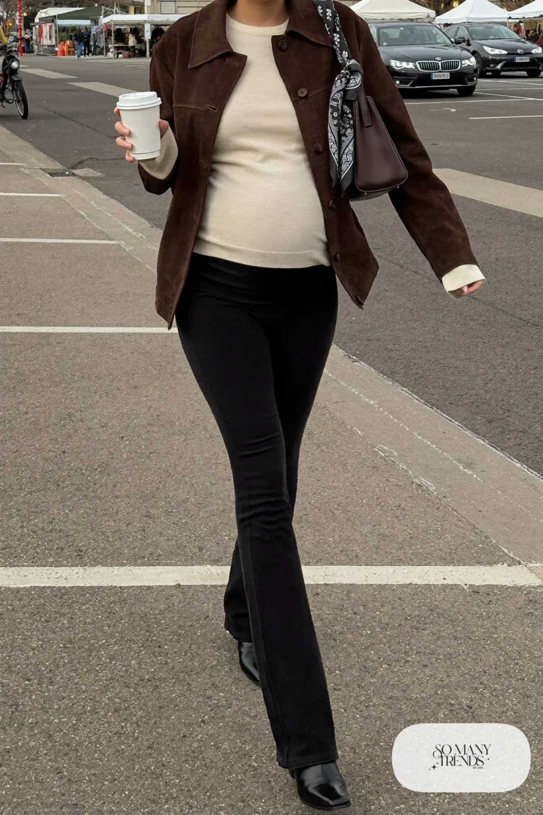 pregnant woman in chocolate suede jacket, cream knit top, black maternity flare jeans and ankle boots, outfit 13