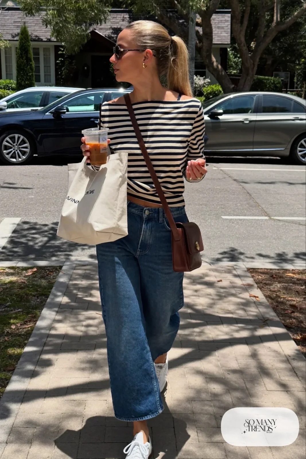 mid-wash barrel jeans navy striped boat-neck top white sneakers crossbody bag outfit 5