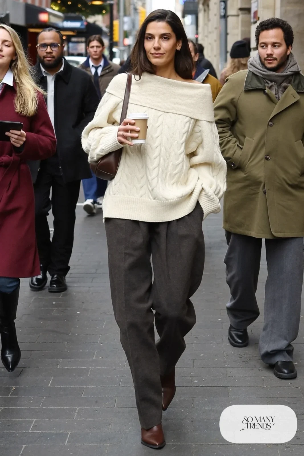 cream cable knit sweater charcoal pleated pants brown leather boots shoulder bag outfit 20