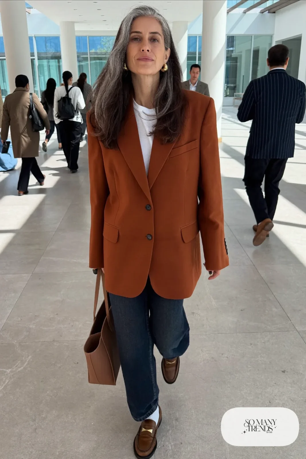 rust oversized blazer white tee dark wide-leg jeans brown loafers tan tote outfit 1
