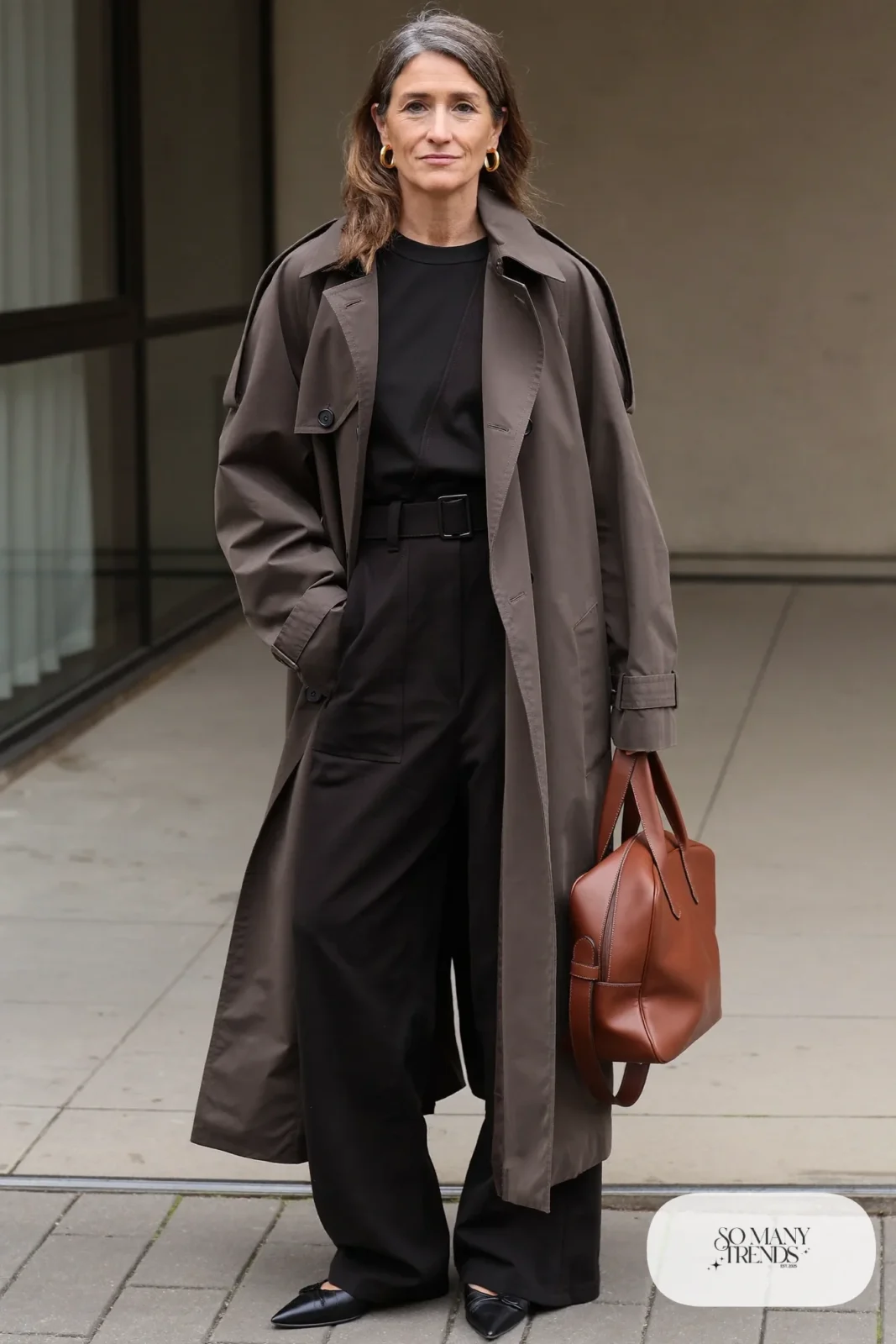 black wide-leg jumpsuit stone belted trench coat pointed flats leather bag outfit 7