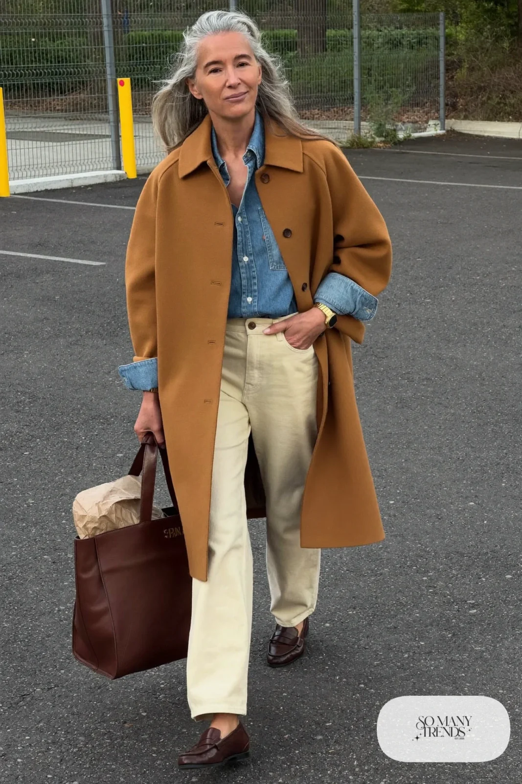 camel long coat denim shirt cream pants brown loafers leather tote outfit 10