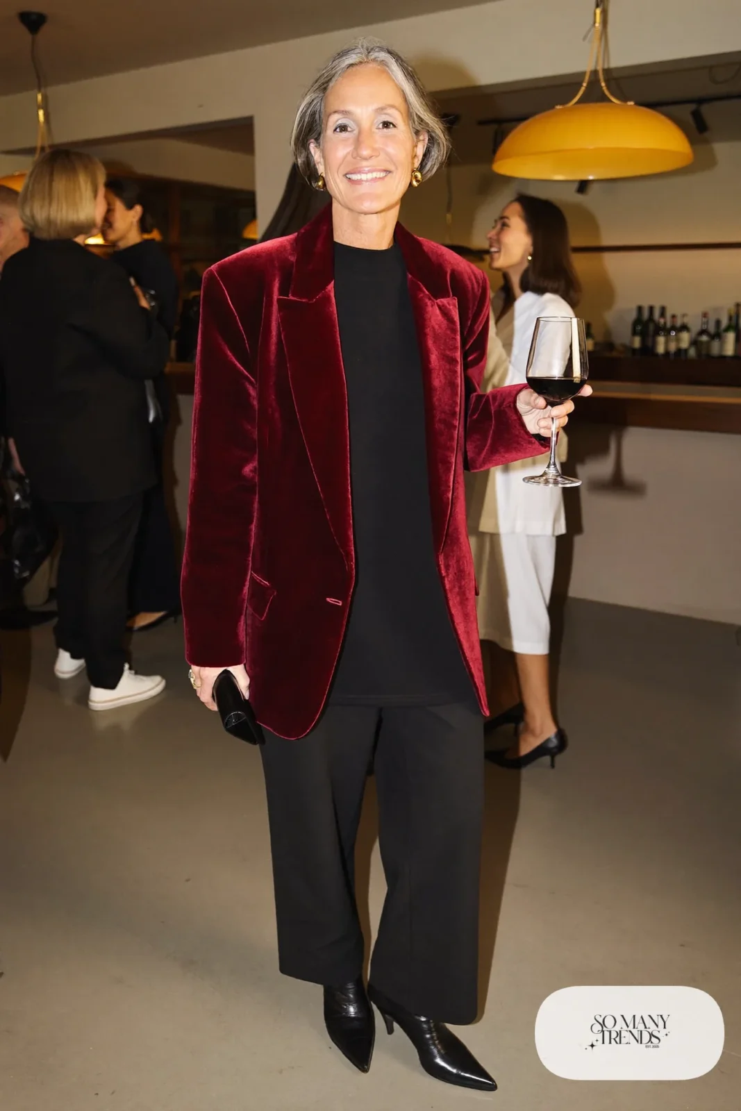 wine velvet oversized blazer black top black wide-leg pants pointed boots clutch outfit 16