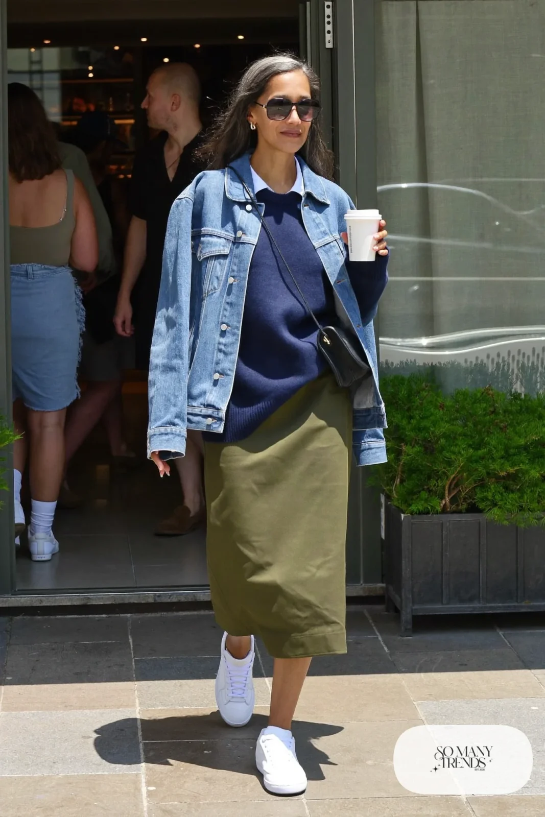 navy sweater olive midi skirt white sneakers denim jacket crossbody bag outfit 24
