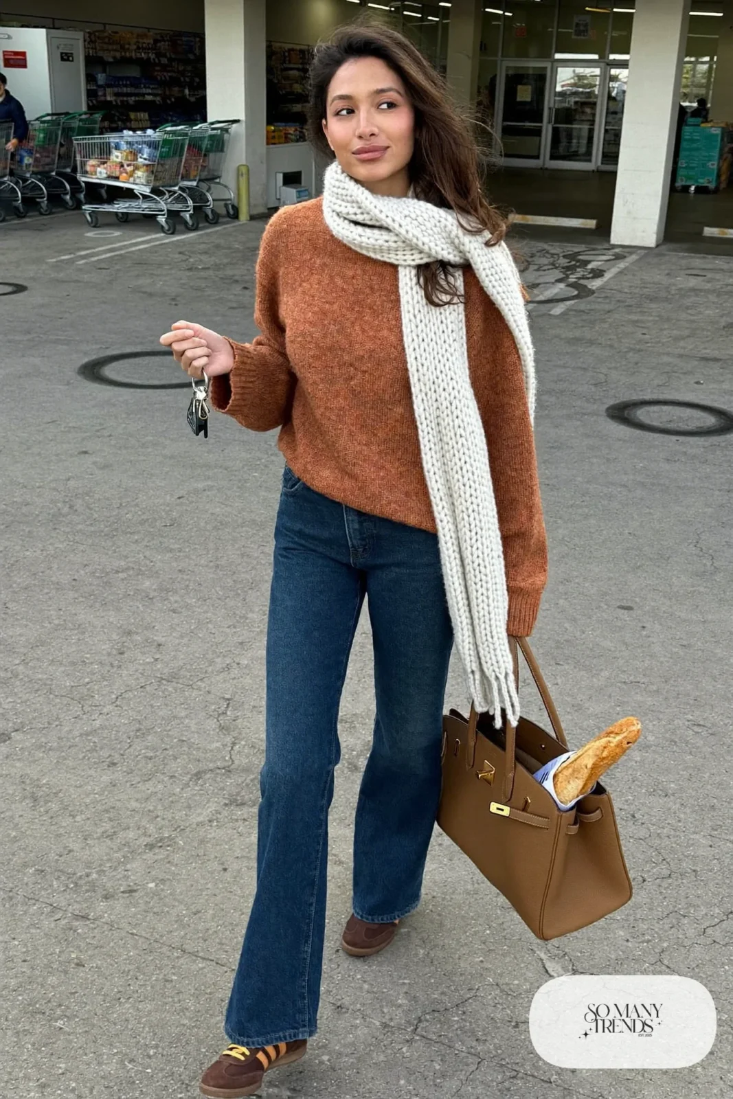 rust wool blend sweater dark straight jeans long scarf leather sneakers tote errand outfit 15