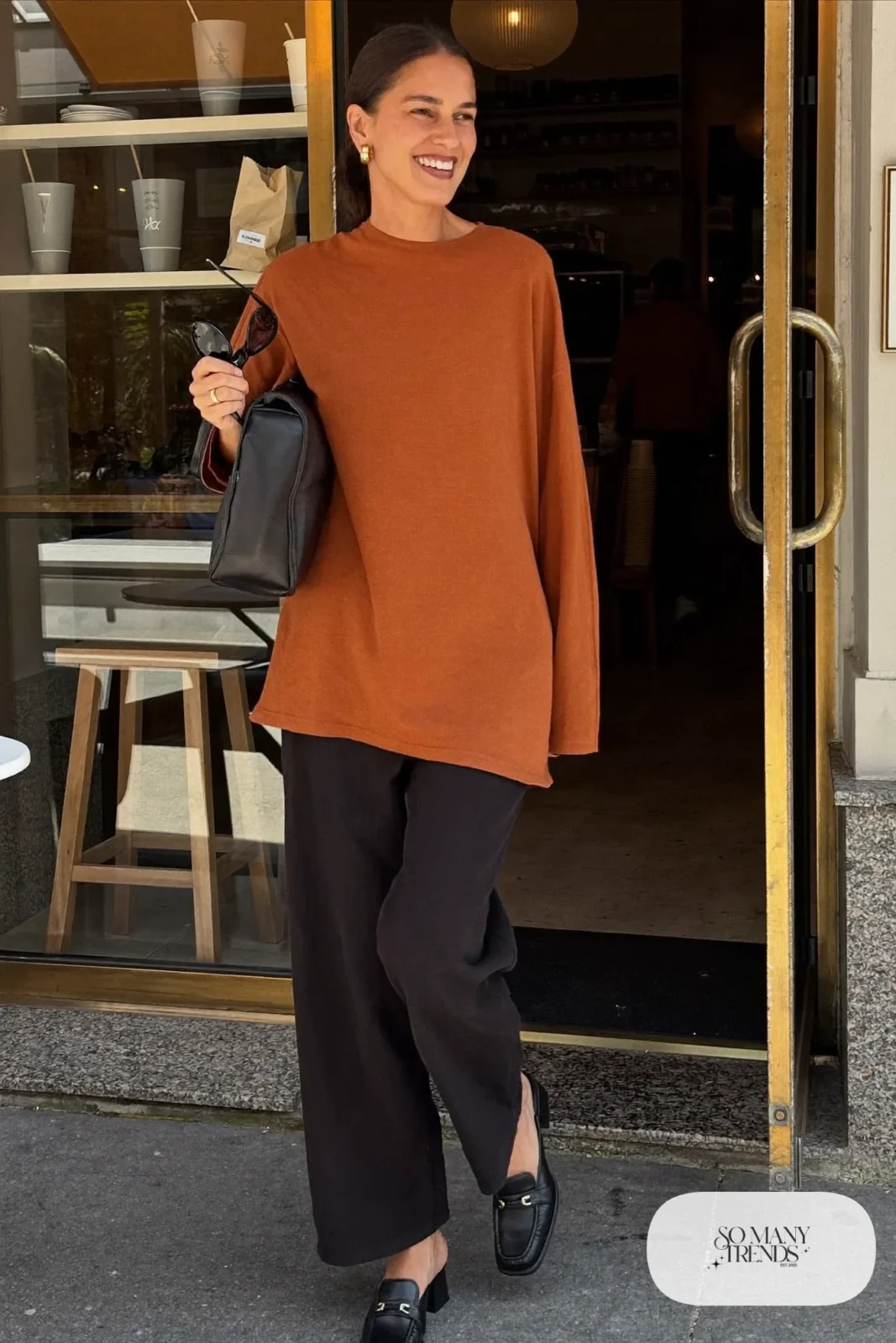 rust wrap top wide-leg black pants block heel mules leather bag dressed-up daytime outfit 27