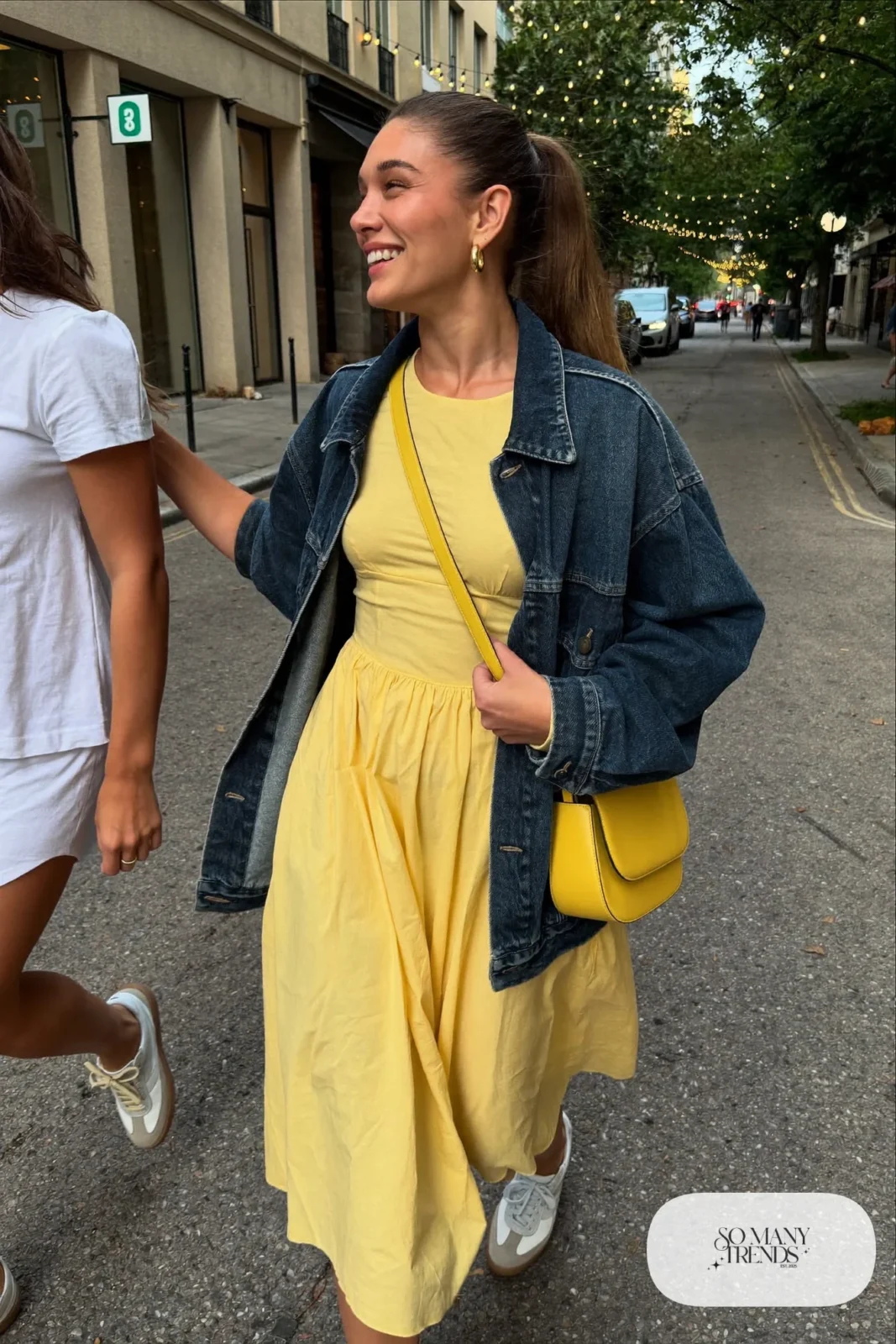 butter yellow midi dress dark denim jacket white sneakers small crossbody date night outfit 33