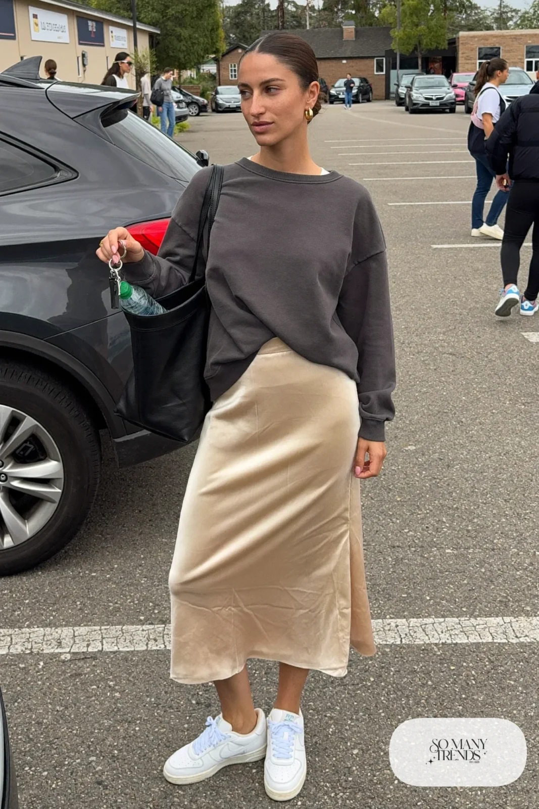 charcoal oversized sweatshirt champagne satin midi skirt white sneakers tote bag outfit 4