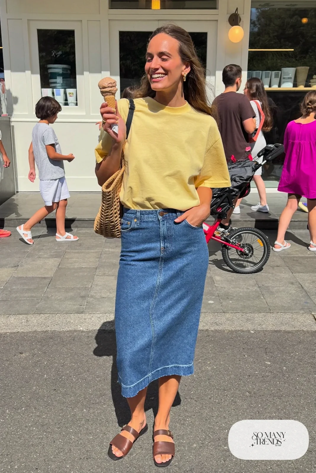 butter yellow boxy tee denim midi skirt leather sandals straw tote outfit 18