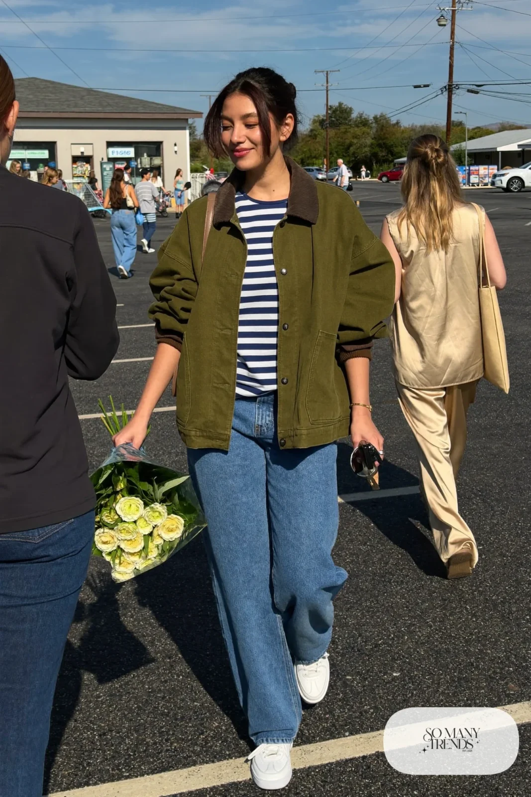 washed olive barn jacket striped tee relaxed jeans white sneakers crossbody bag outfit 30