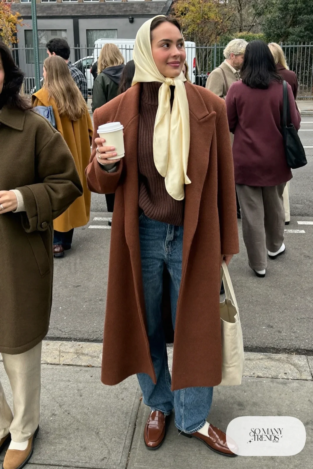 rust oversized wool coat chocolate turtleneck wide-leg jeans loafers with socks outfit 1