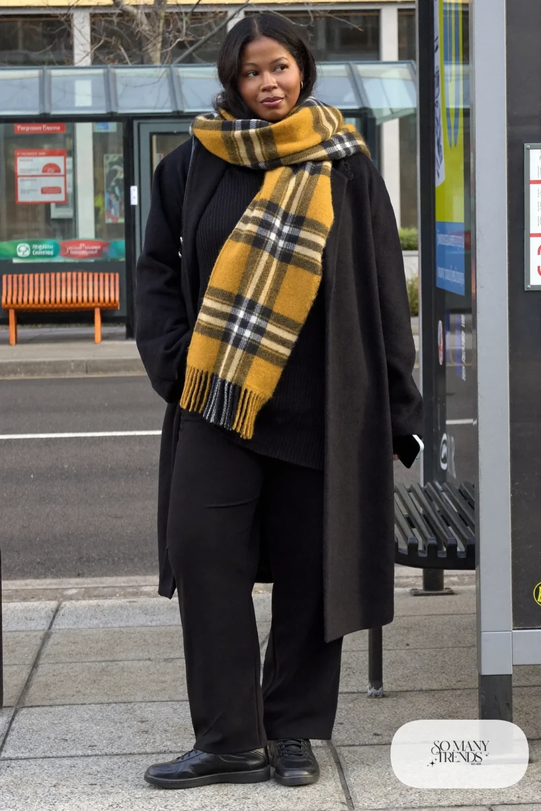mustard blanket scarf black coat black ribbed sweater black pants sneakers outfit 6