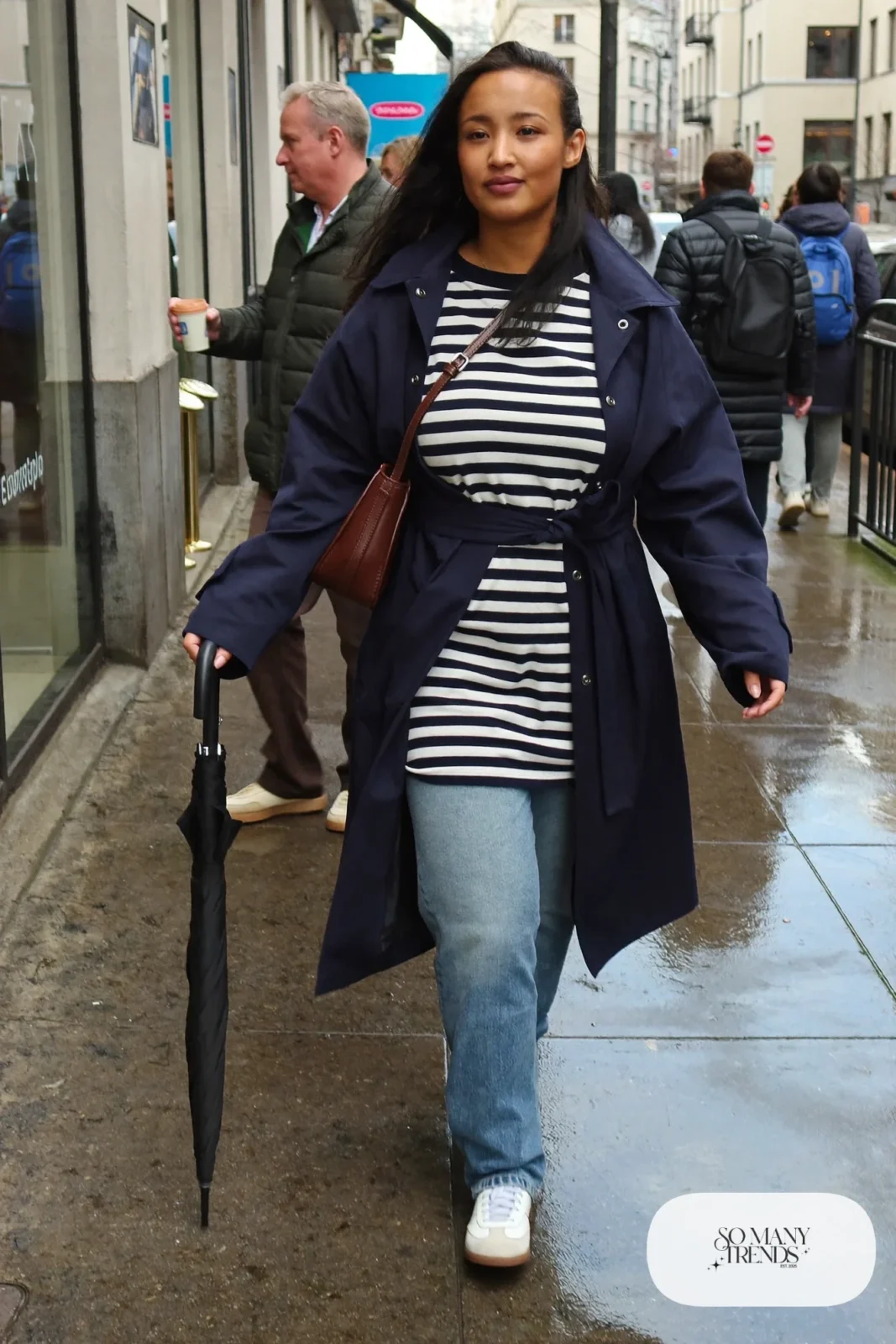 navy trench coat striped tee straight jeans white sneakers outfit 14