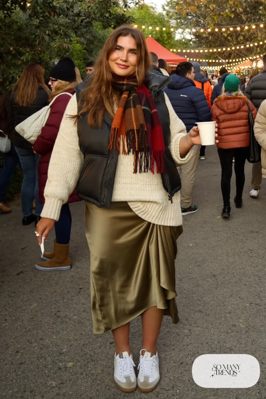 olive satin midi skirt cream chunky sweater sneakers puffer vest outfit 31