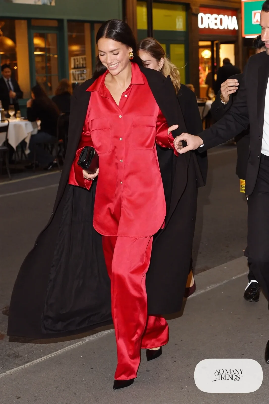cherry red satin shirt matching wide-leg satin pants black pointed pumps black long coat outfit 14