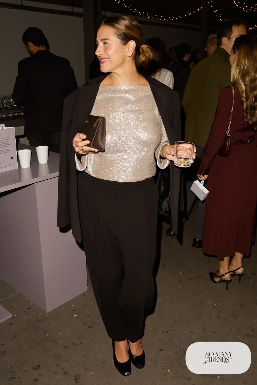 champagne sequin top black wide-leg tailored pants black blazer closed-toe pumps clutch outfit 15