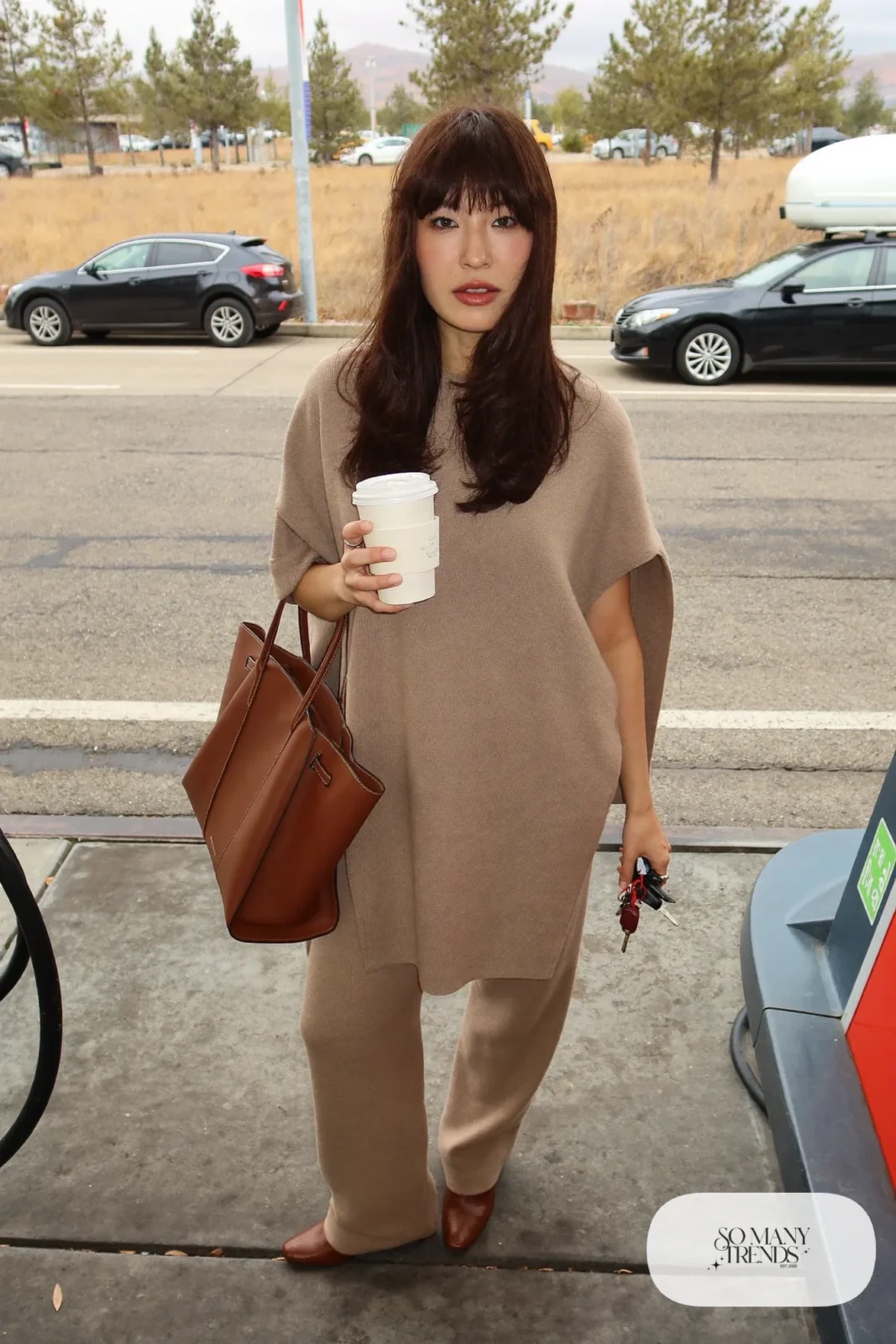 taupe knit poncho top matching straight pants brown leather boots leather tote scarf outfit 23