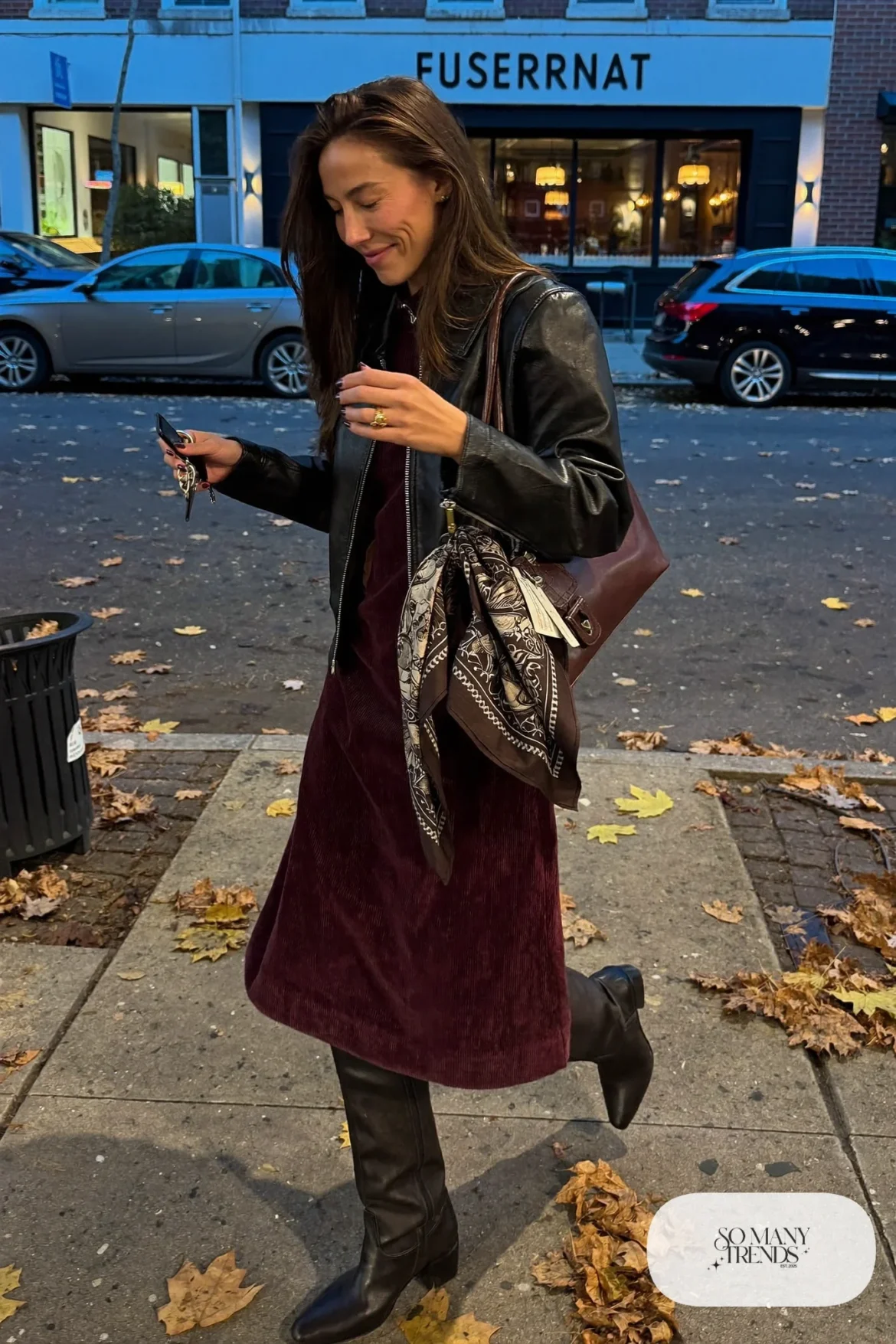 plum corduroy midi dress cropped black leather jacket tall black boots silk scarf on bag outfit 11
