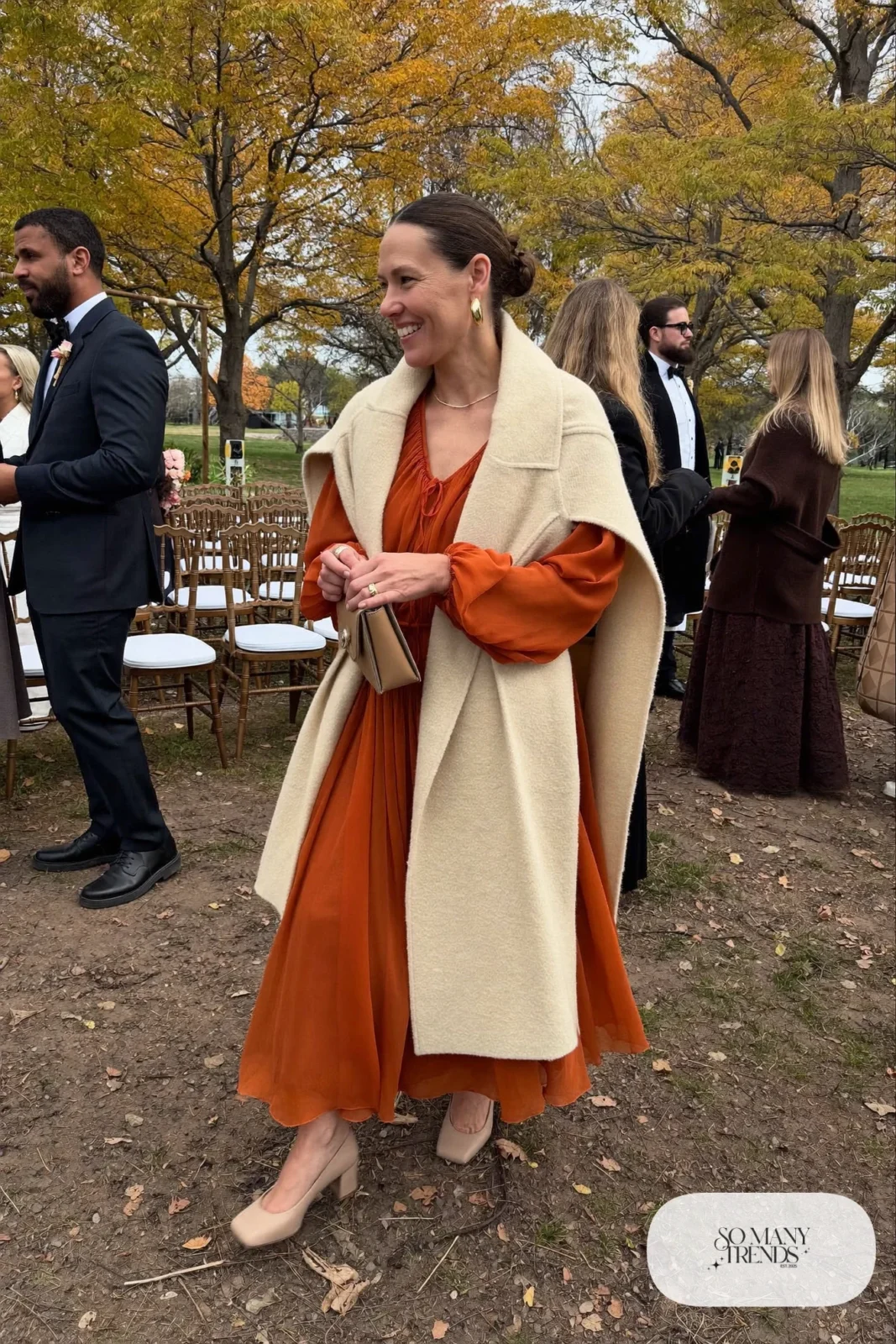 burnt orange chiffon long sleeve midi dress cream wool wrap nude block heel pumps gold earrings clutch outfit 15