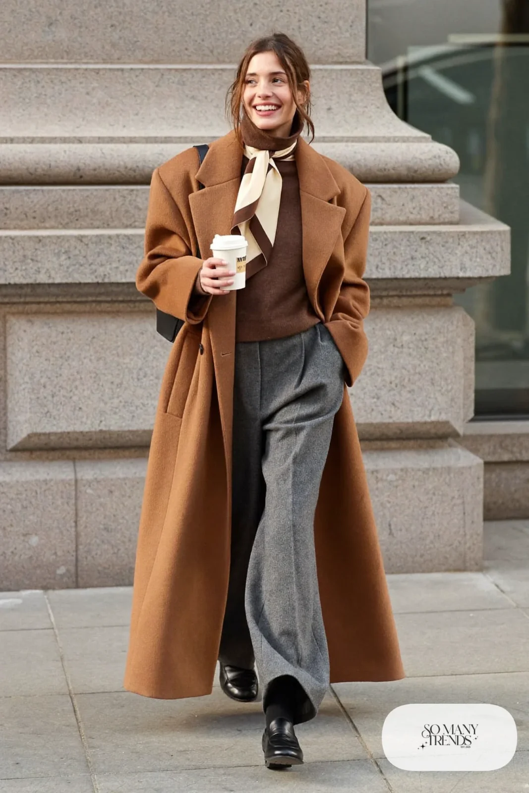 camel long wool coat chocolate turtleneck wide-leg charcoal pants black loafers silk scarf outfit 1