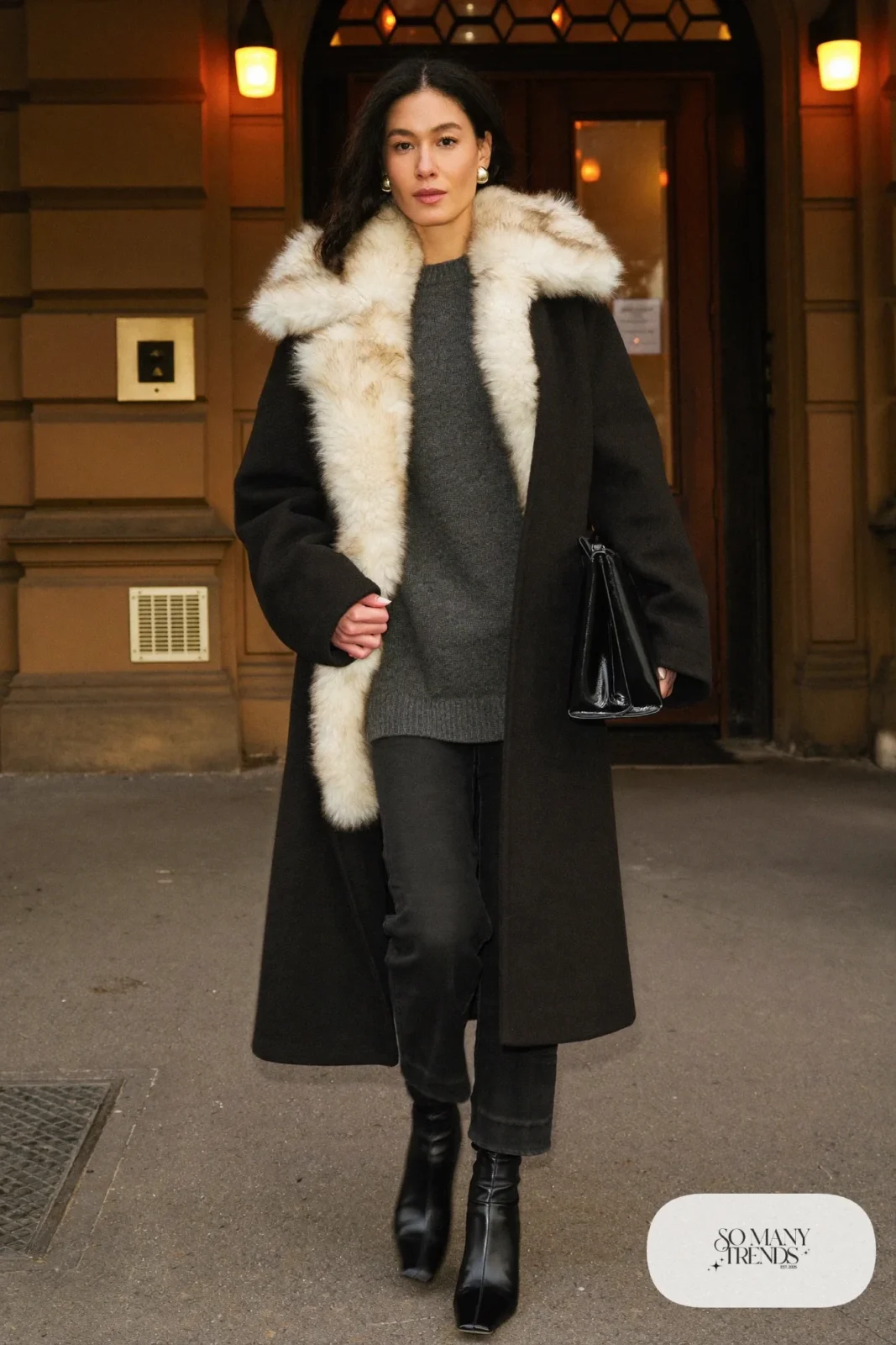 black wool coat cream faux fur collar charcoal knit dress sweater black pants boots outfit 11