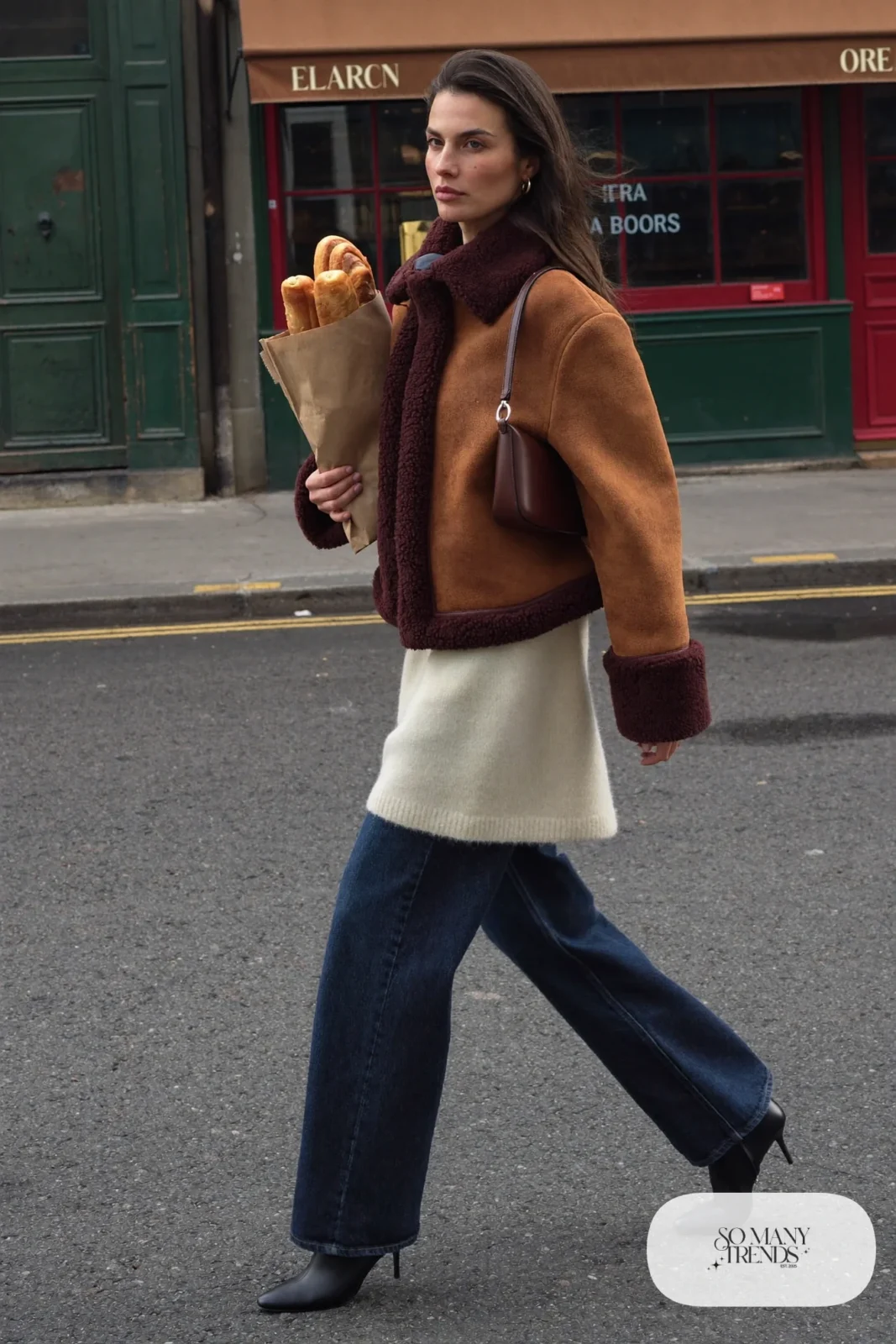 tan shearling-look boxy jacket cream sweater dark wide-leg jeans leather boots shoulder bag outfit 12