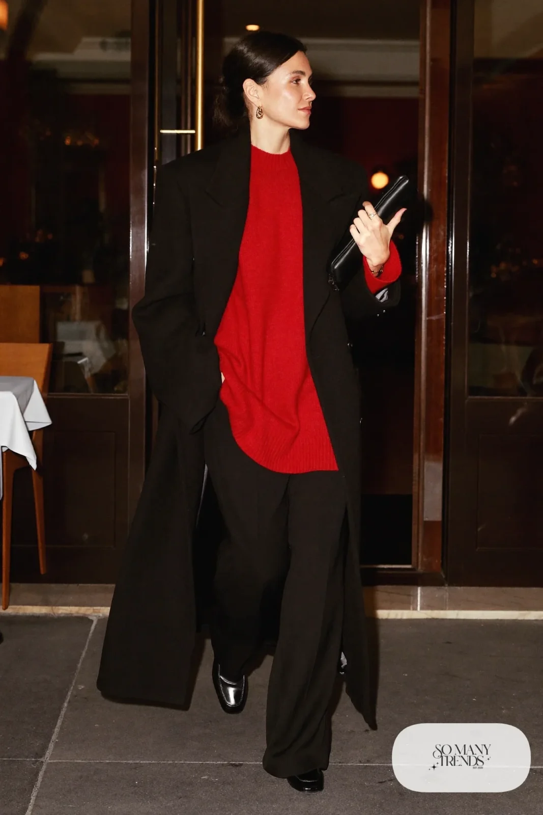 cherry red fine knit sweater black wide-leg pants black loafers long black coat clutch outfit 22