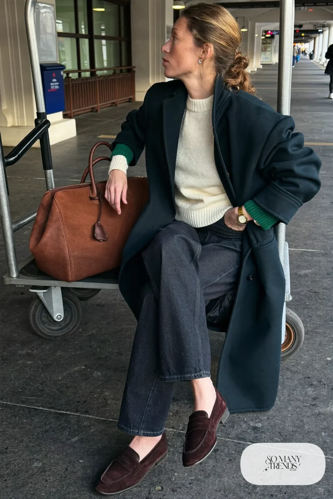 dark wide-leg jeans cream sweater navy long coat brown loafers leather weekender travel outfit 28