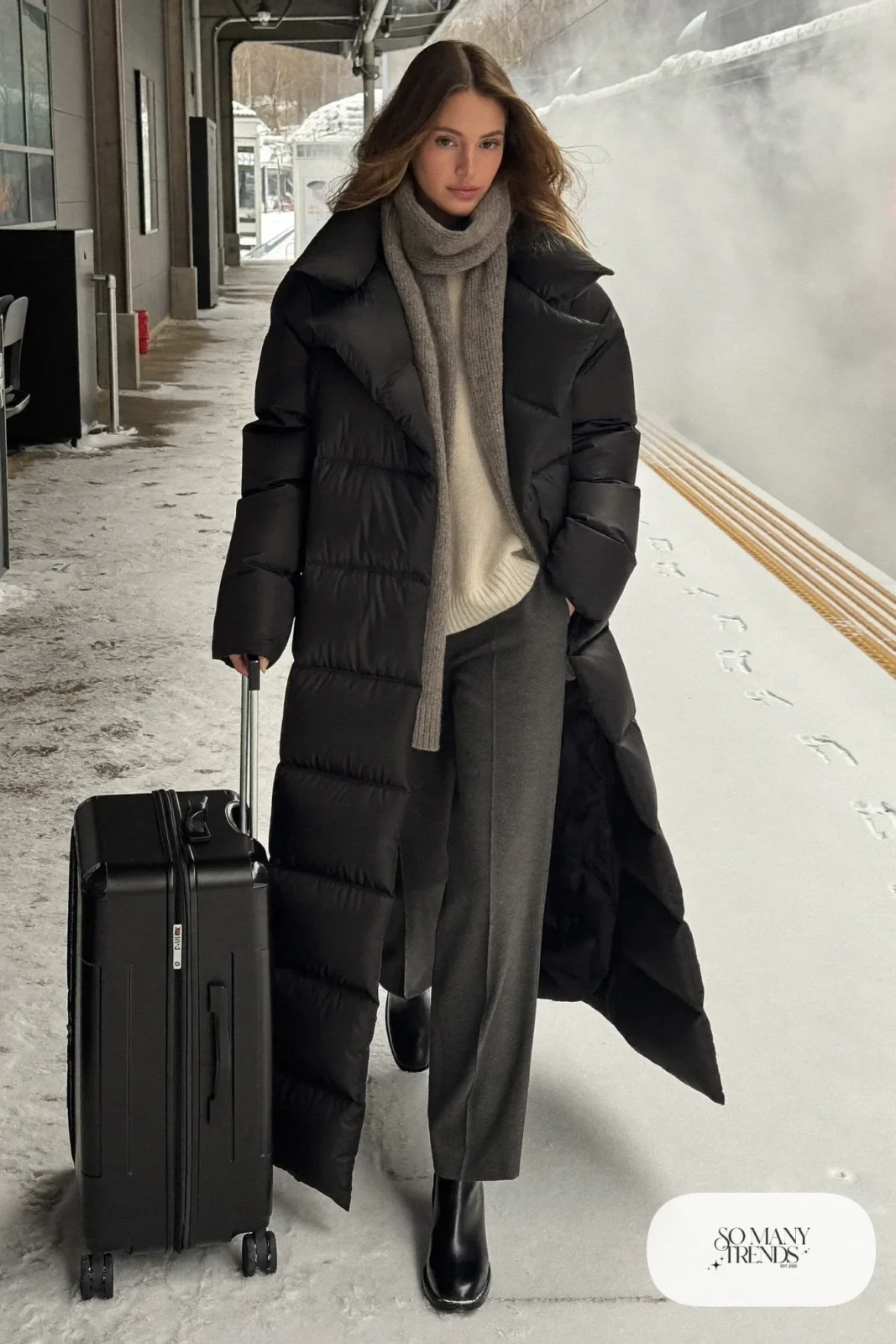 long matte black puffer coat cream knit straight gray pants leather boots wool scarf travel outfit 31