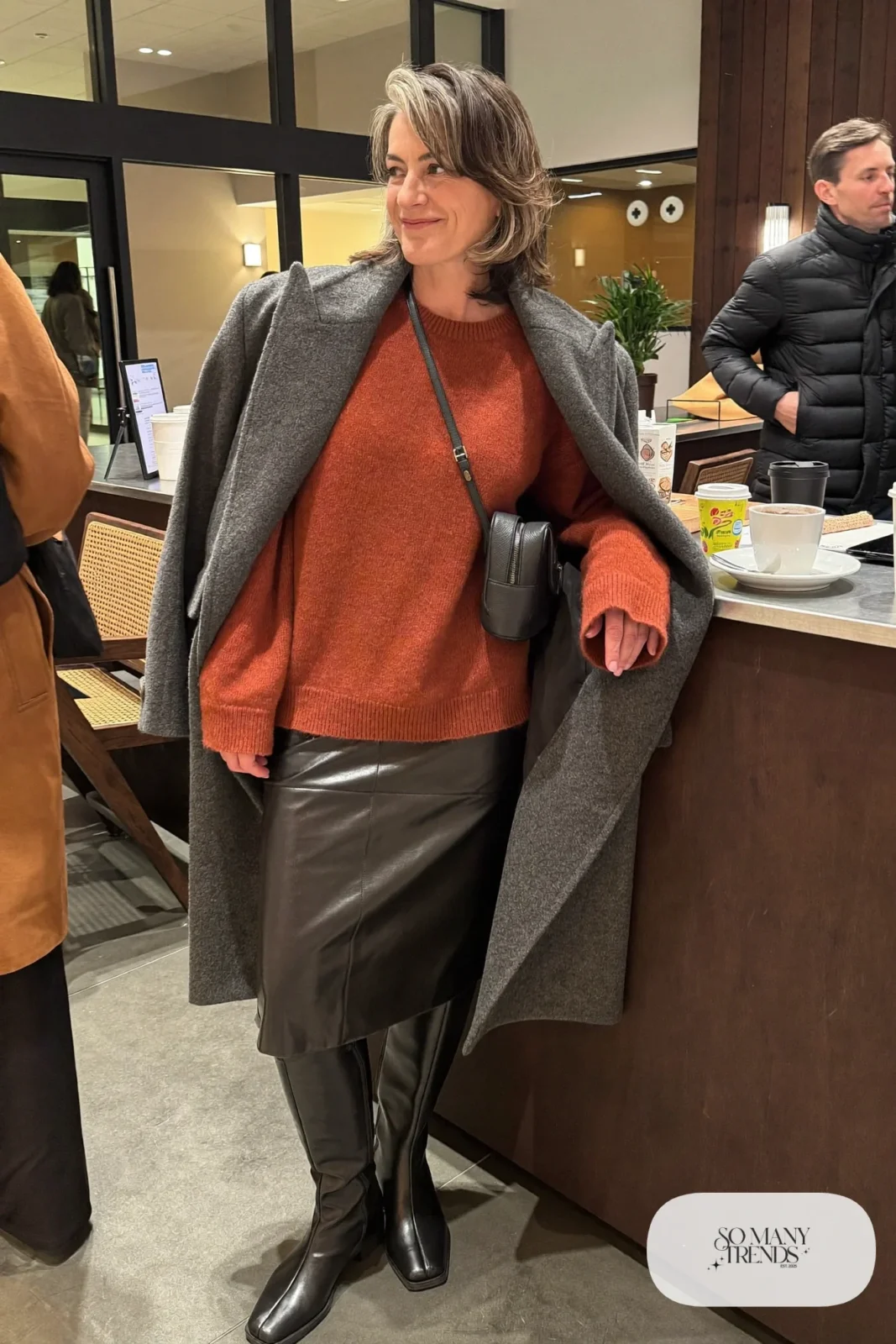 black faux leather midi skirt rust boxy sweater black knee-high boots gray wool coat outfit 5
