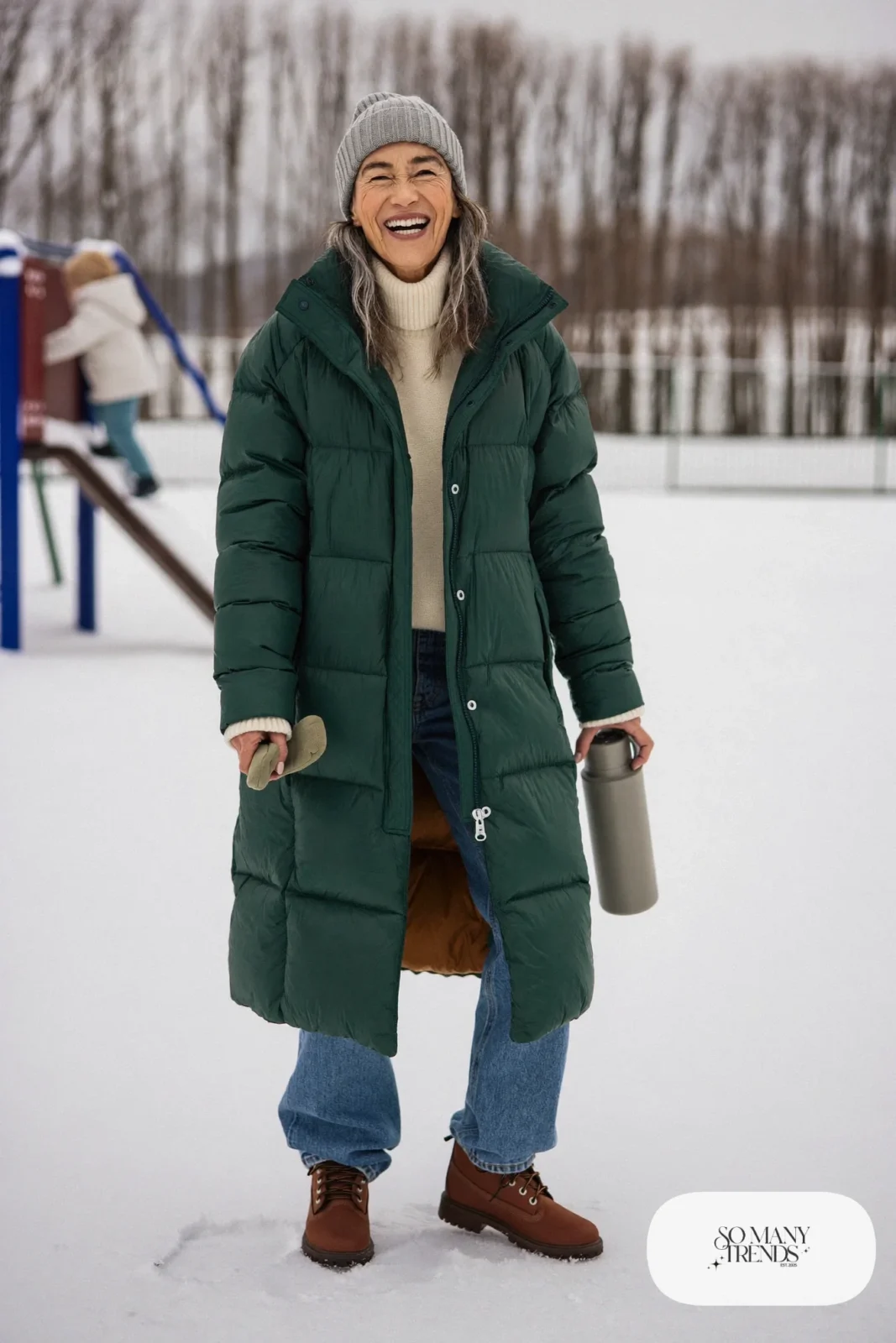 long forest green puffer coat chunky cream sweater relaxed jeans waterproof boots beanie outfit 13