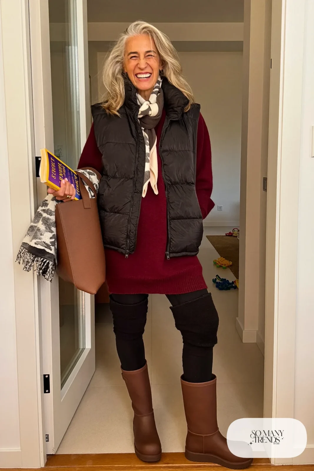 fleece-lined black leggings long burgundy sweater ankle boots puffer vest outfit 14